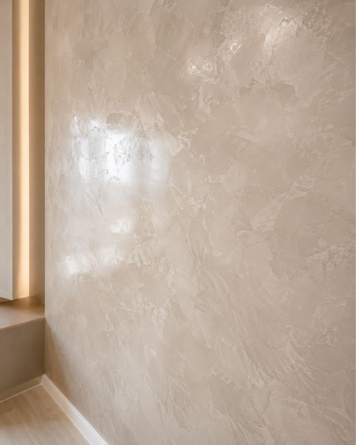Close up of a polished venetian plaster feature wall showing depth, movement and sheen