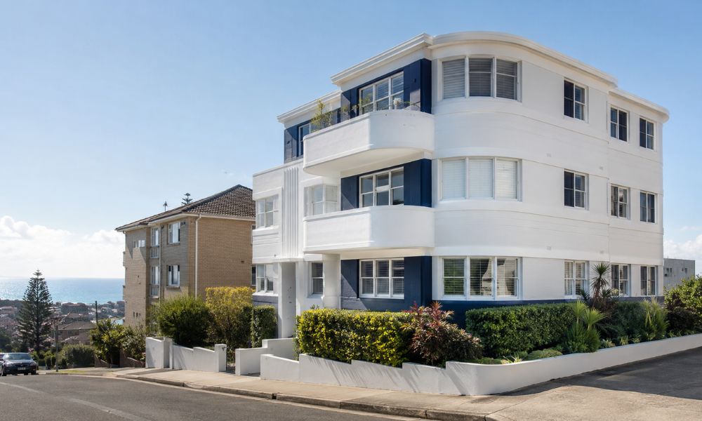 Freshly repainted Art Deco apartment block exterior on a Bondi hillside street