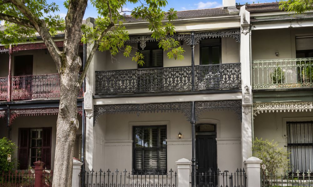 Before and after of a rendered Victorian terrace facade repainted in the Inner West