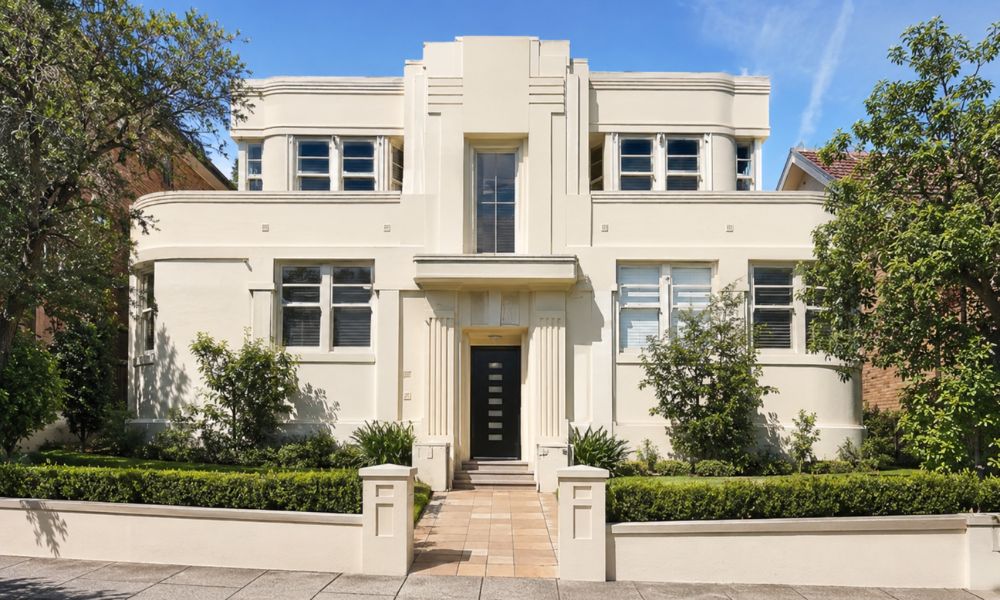Freshly repainted Art Deco apartment block facade with restored render detail in Neutral Bay