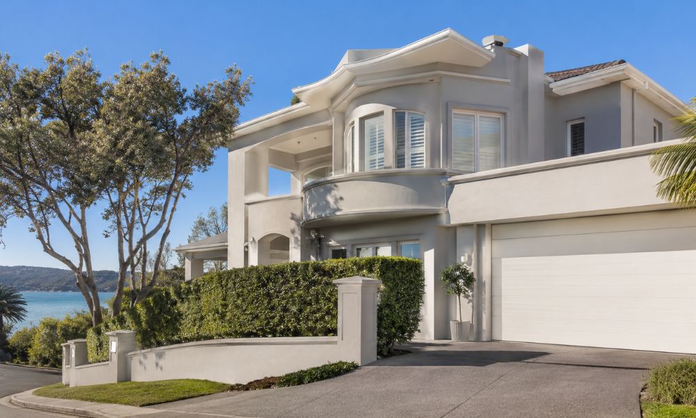 Fresh coastal coating on a rendered Newport house facade in a soft neutral tone