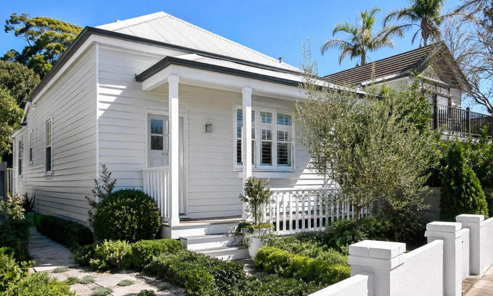Weatherboard cladding restored and repainted on a Newport home near the beach