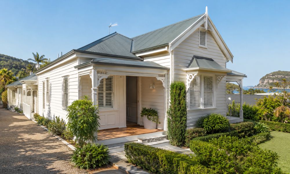 Repainted heritage weatherboard cottage exterior in Palm Beach with a coastal colour scheme