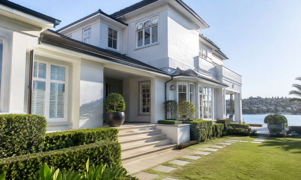 Rose Bay waterfront house exterior painted with a salt-resistant coating under bright harbour light