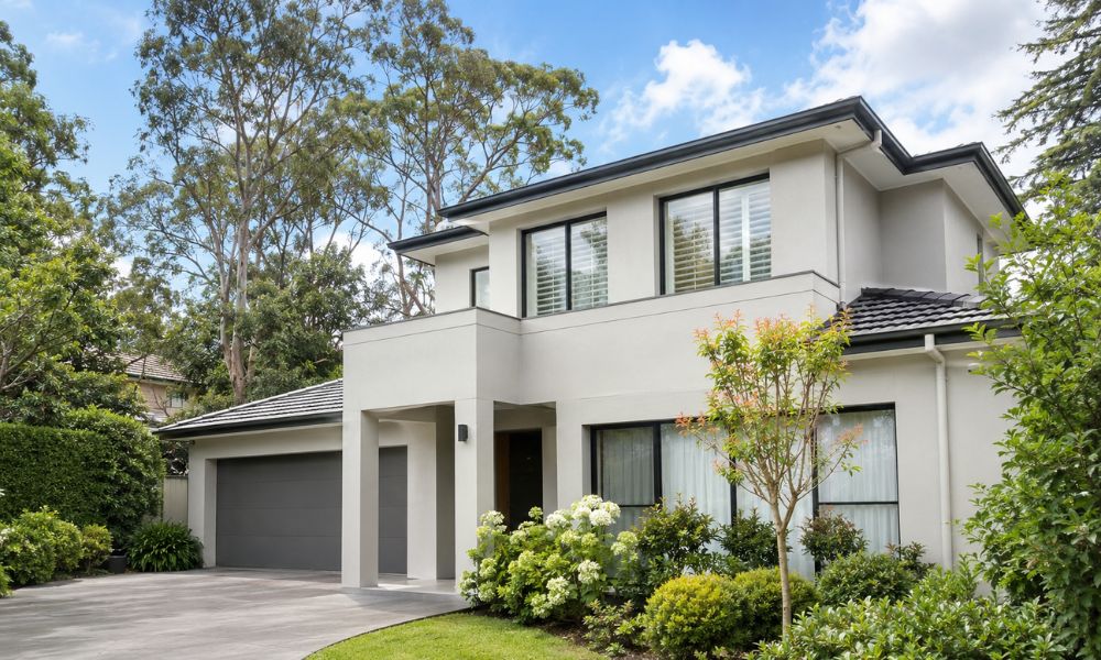 Freshly repainted rendered exterior of a two-storey St Ives home in a warm neutral