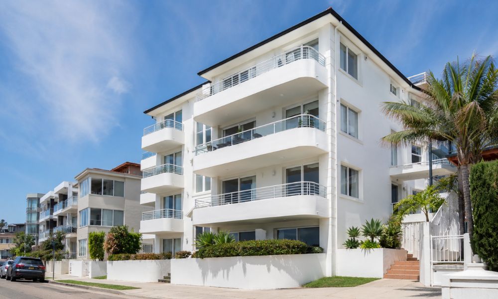 Repainted apartment balcony and rendered facade on a coastal Bondi building
