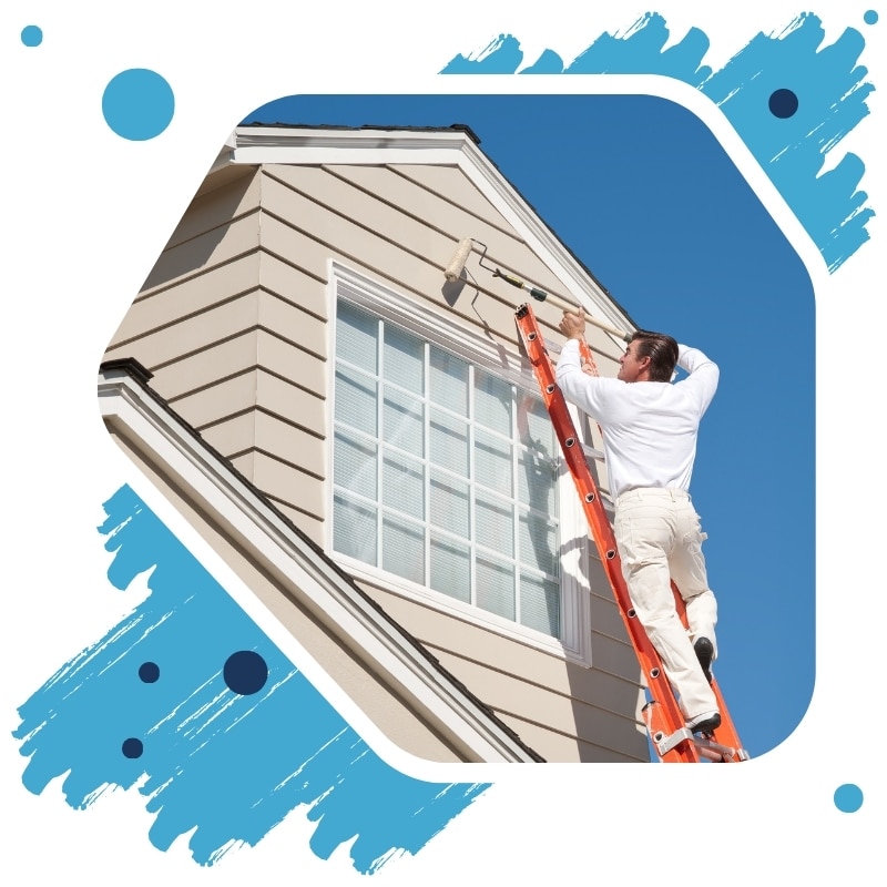 A man in a white shirt is painting the exterior of a house using an orange ladder and paint brush roller.