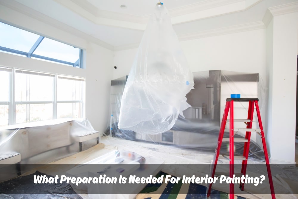 Living room interior paint preparation in progress. Room is covered in plastic sheeting and a paint ladder is positioned in the center.