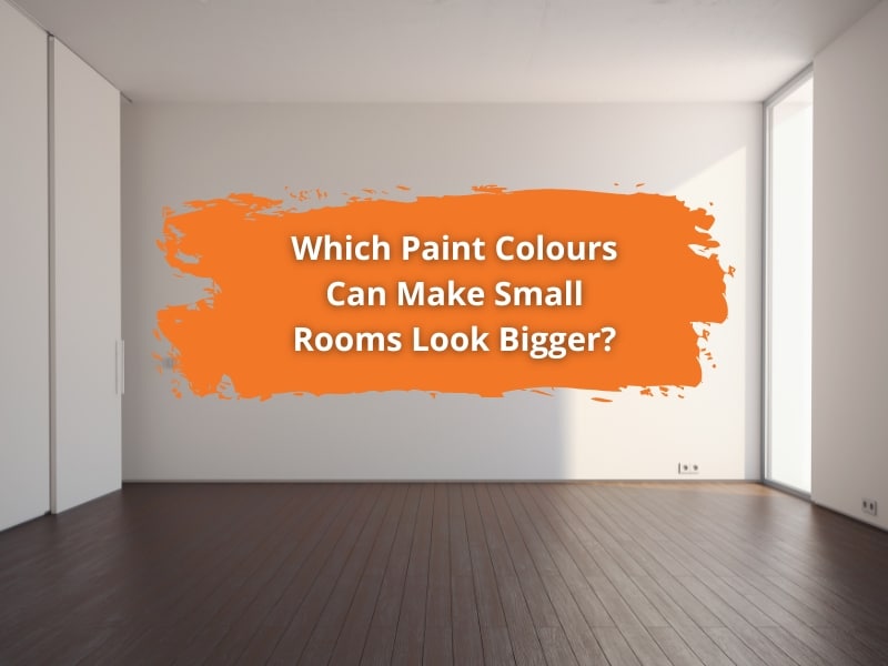 A minimalist room with white walls and dark flooring, highlighting paint colours for small rooms to create a spacious feel.