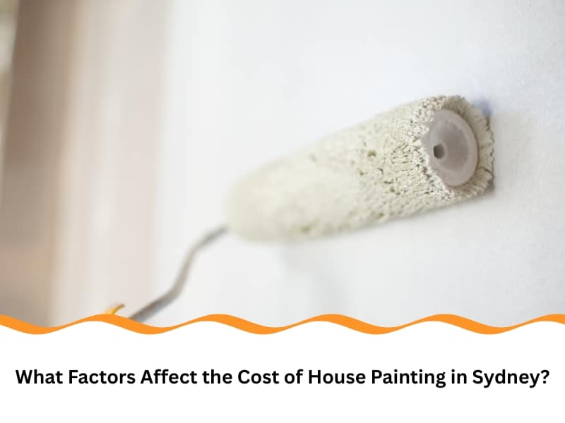 White paint roller applying paint to a wall. This affects the house painting cost.