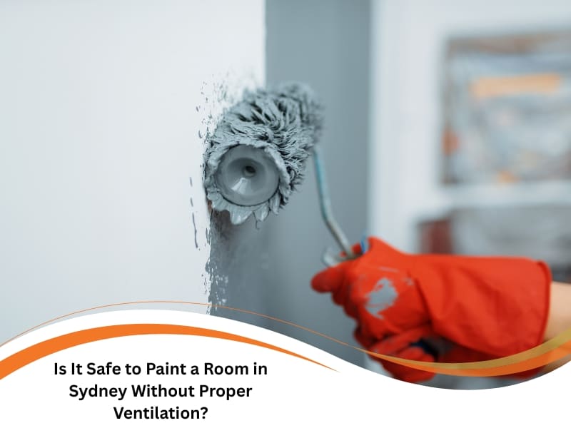 A gloved hand uses a roller to paint a room wall grey. Text asks about safety without ventilation in Sydney.