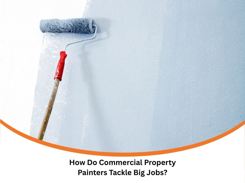 commercial property painters using roller for large-scale wall painting