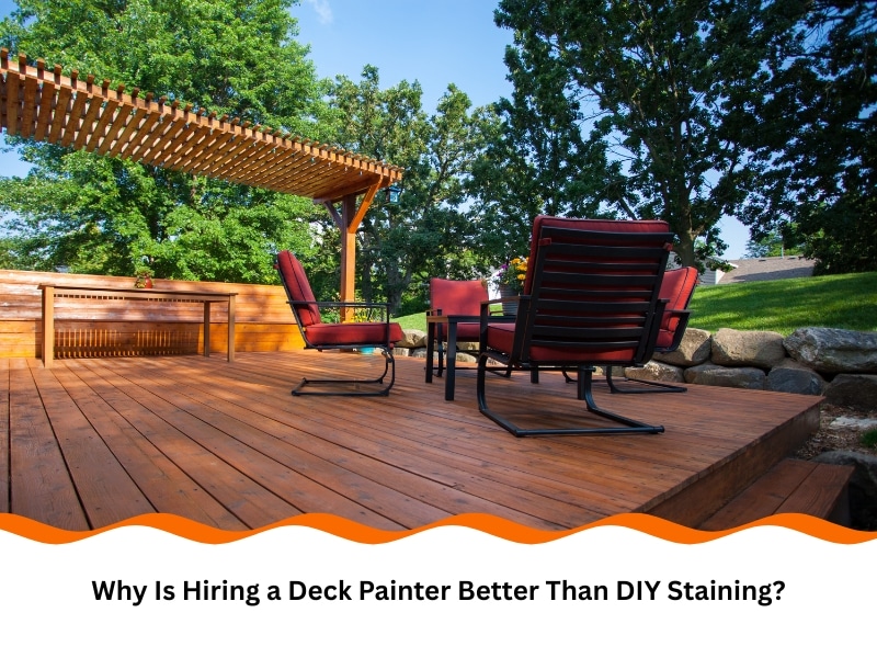 Deck Painter finished wooden patio with chairs, pergola, and garden in background