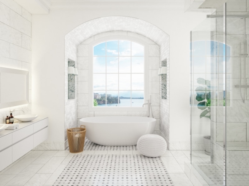 Modern bathroom painting shows white walls and tiled interior with bathtub and large arched window.