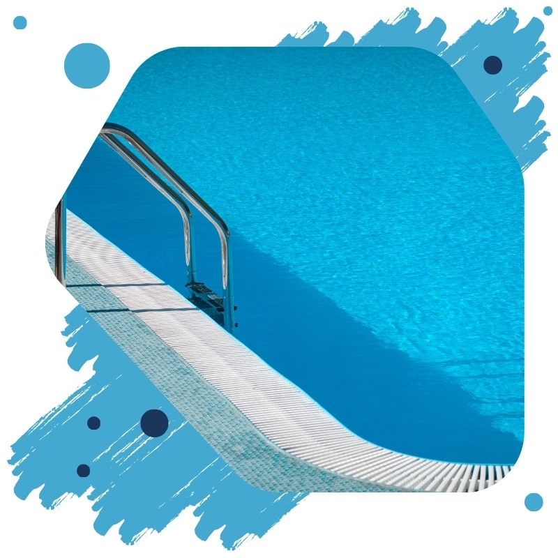 Close-up of a repainted swimming pool in Sydney with a shiny blue epoxy finish and stainless steel ladder.