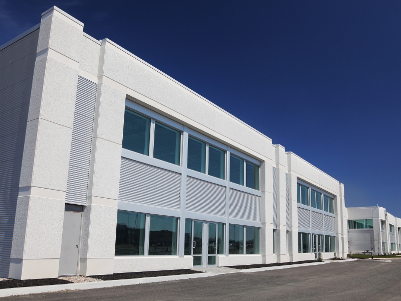White and grey exterior highlighting neutral commercial building paint colours.