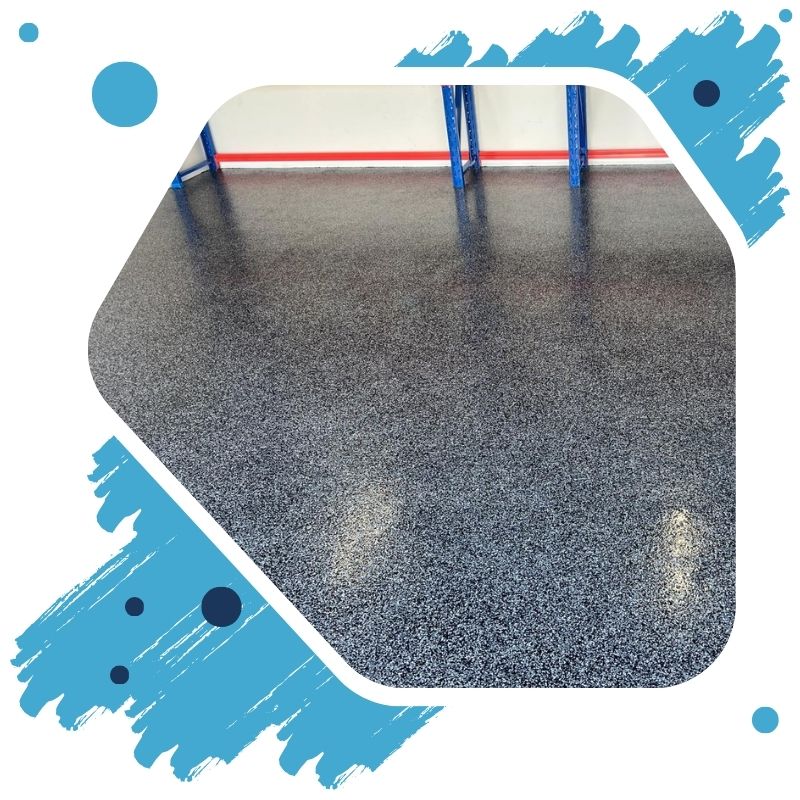 The worker applies gray epoxy resin flooring to the new floor