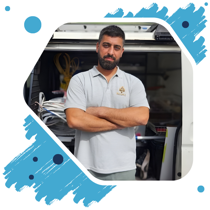 Skilled painter in sydney applying vibrant, high-quality paint on a modern residential building exterior in a bright urban scene.